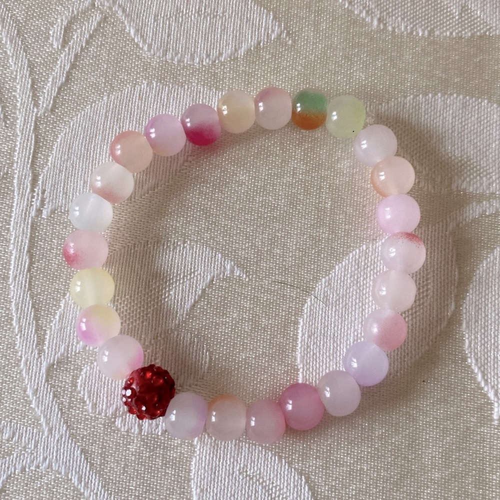 Colorful marble stackable 8mm beaded bracelet with red crystal accent bead
